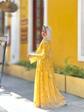 Yezwe modest maxi dress online in vibrant yellow with floral patterns and long sleeves